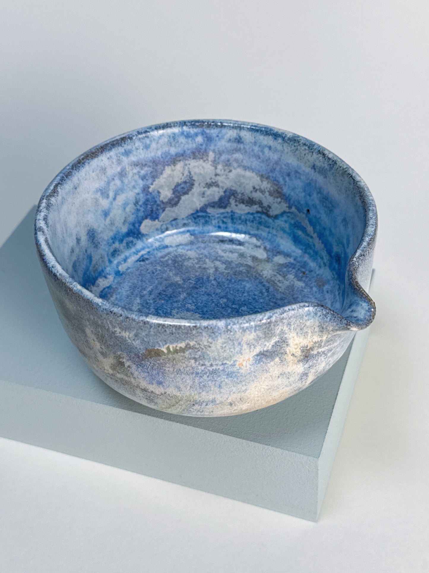 Blue ceramic bowl on a white background