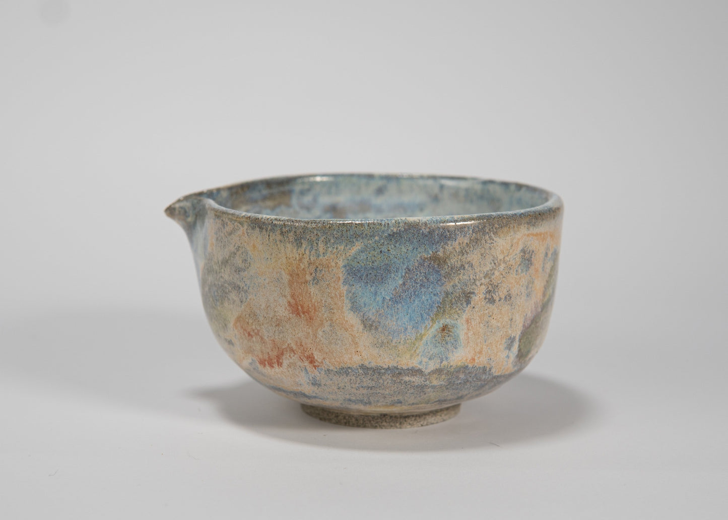 Ceramic bowl with textured surface on a white background