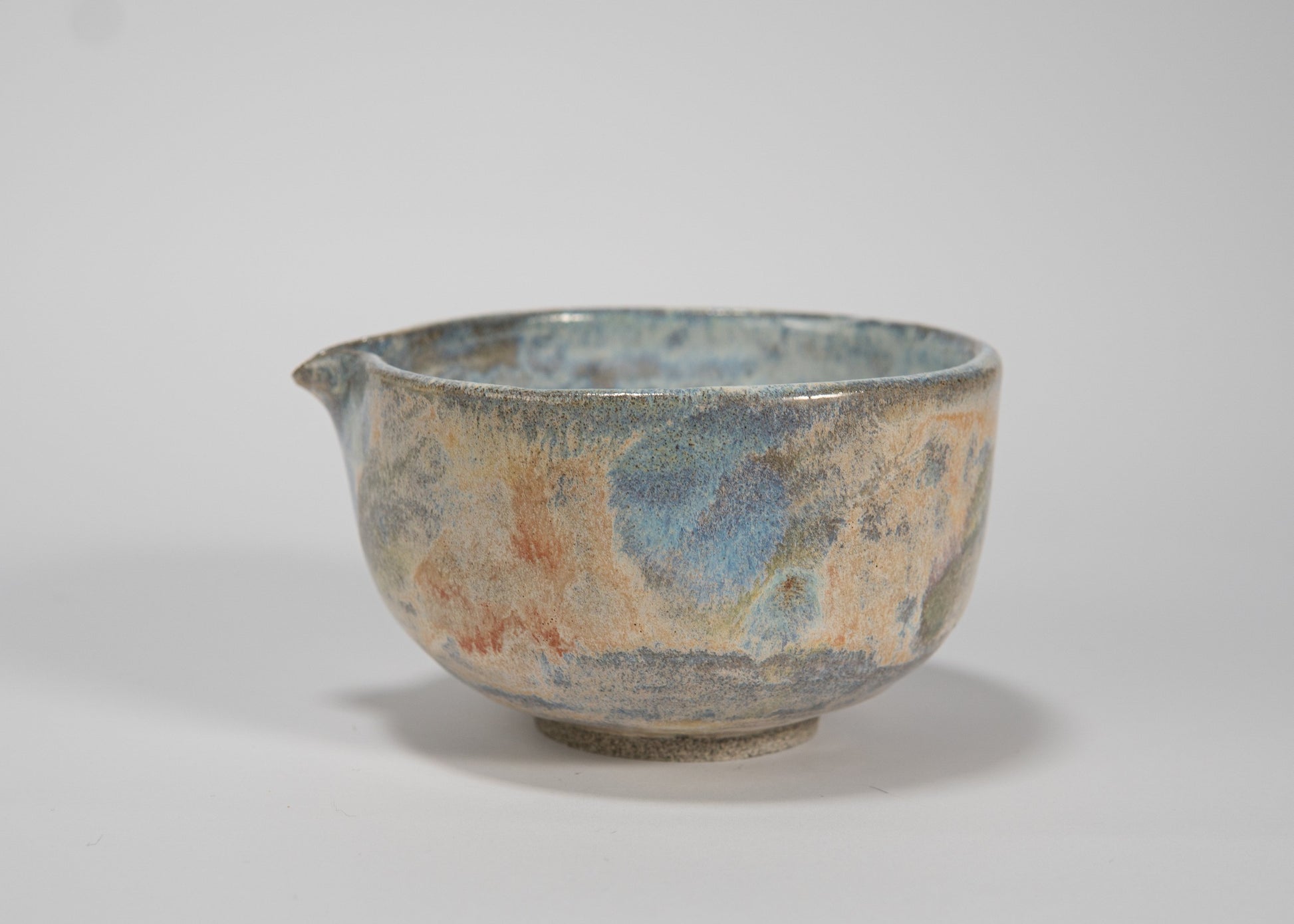Ceramic bowl with textured surface on a white background