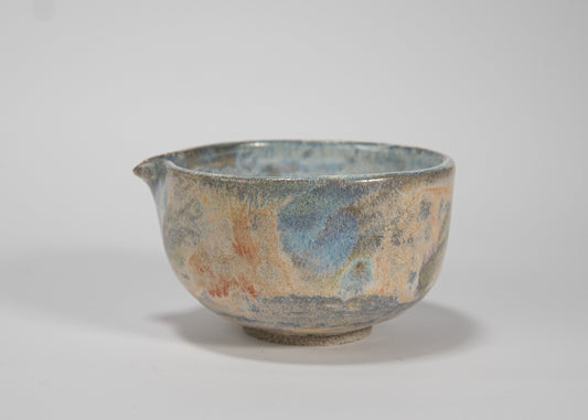 Ceramic bowl with textured surface on a white background