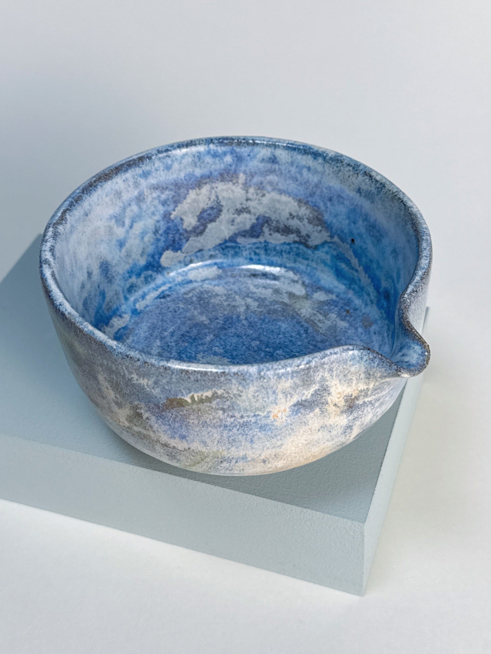 Blue ceramic bowl on a white background