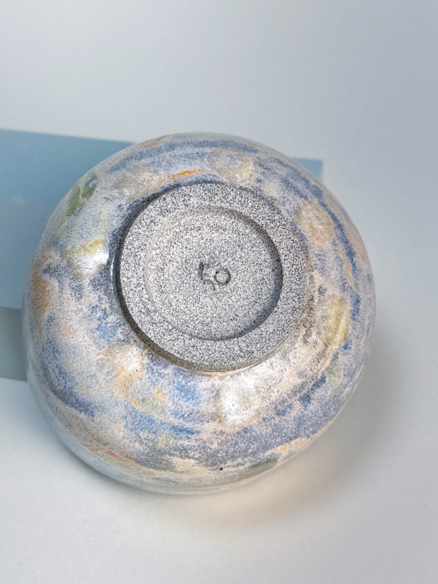 Ceramic bowl with textured surface on a white background